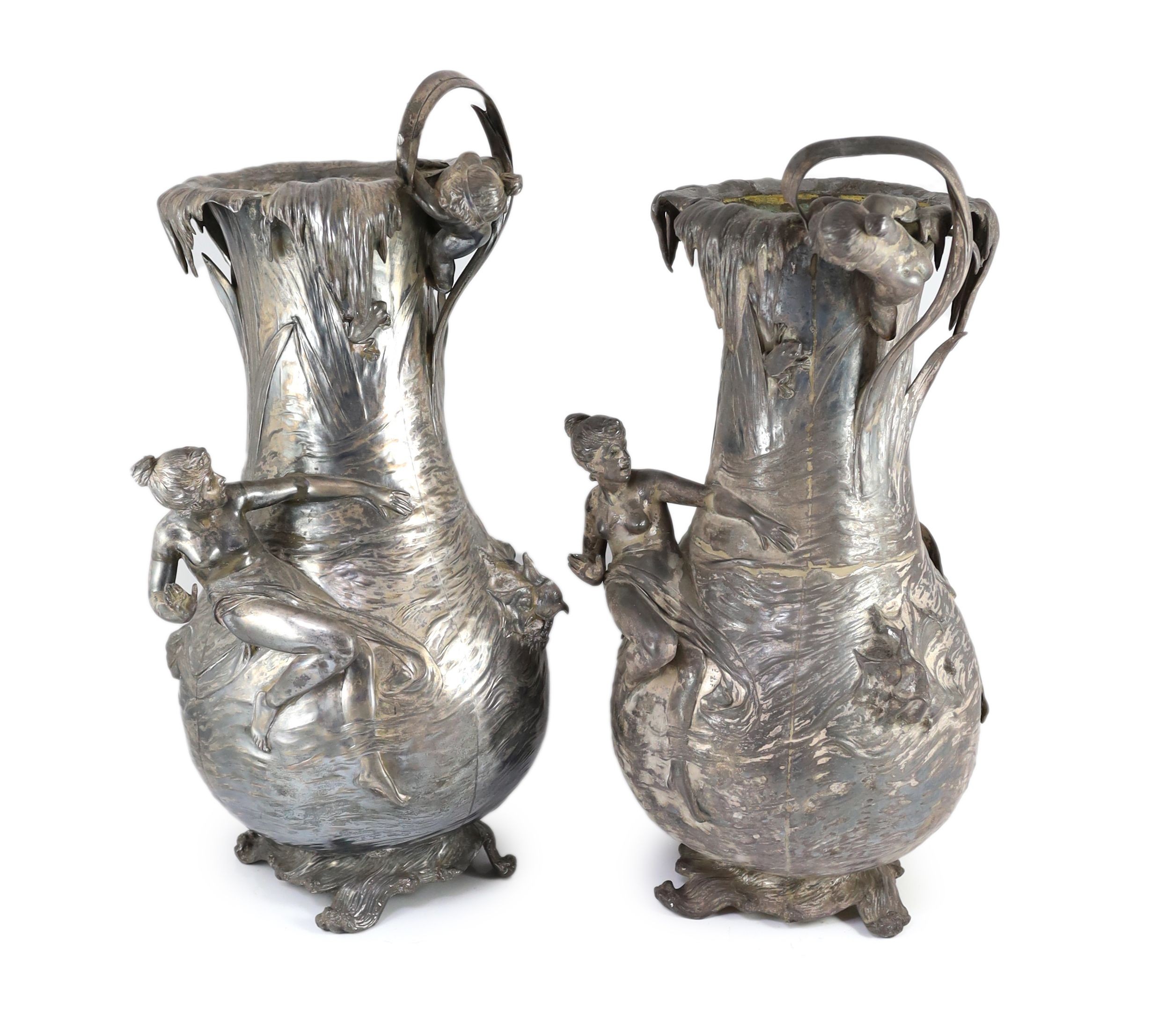 A pair of very large WMF Art Nouveau silvered pewter vases, height 61cm